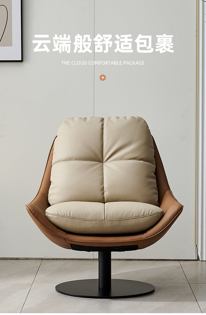 Modern swivel lounge chair with a high-back and removable cushions, upholstered in off-white faux leather with a black metal base