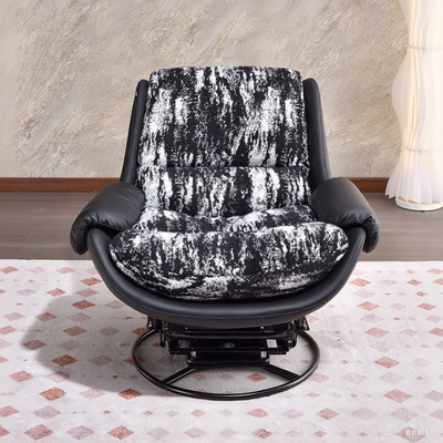 A Modern 360° Rotatable Ergonomic Accent Chair With a Black Faux Leather Base And a White And Black Floral Fabric Cushion