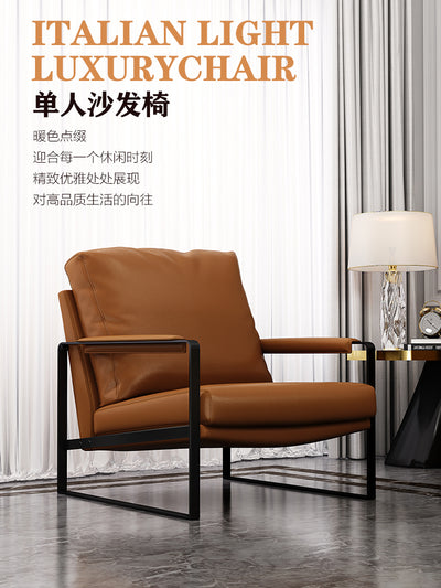 Mid-century Modern Accent Chair Featuring Brown Faux or Genuine Leather Upholstery and a Black Metal Frame