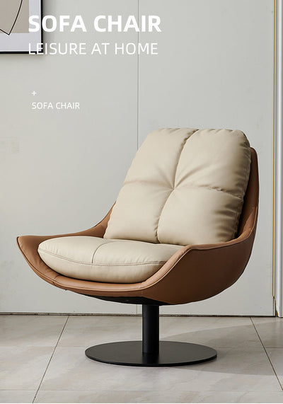 Modern swivel lounge chair with a high-back and removable cushions, upholstered in off-white faux leather with a black metal base