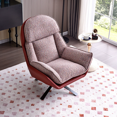 A Modern Fabric And Leather Accent Chair With a Swivel Base