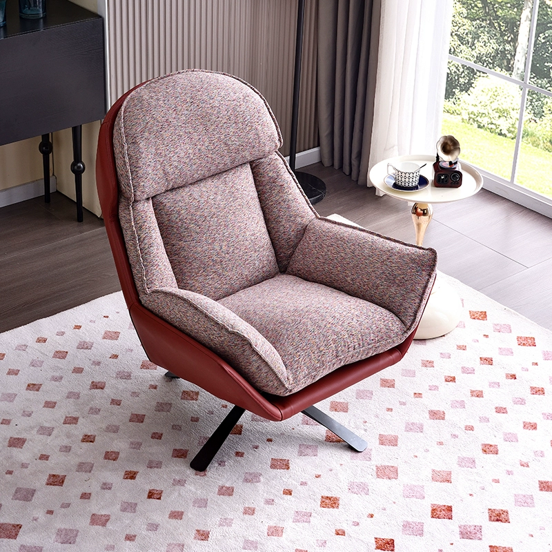 A Modern Fabric And Leather Accent Chair With a Swivel Base