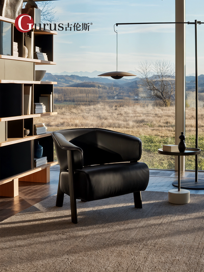 Cassina 571 Back-wing Armchair Designed by Patricia Urquiola With a Black Ash Wood Base