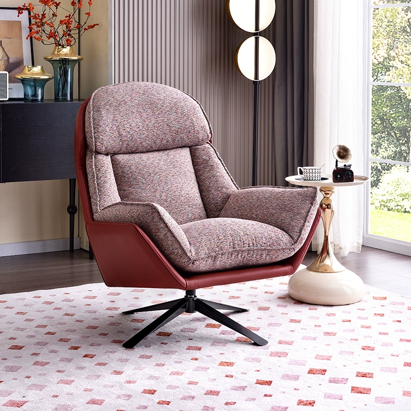 A Modern Fabric And Leather Accent Chair With a Swivel Base