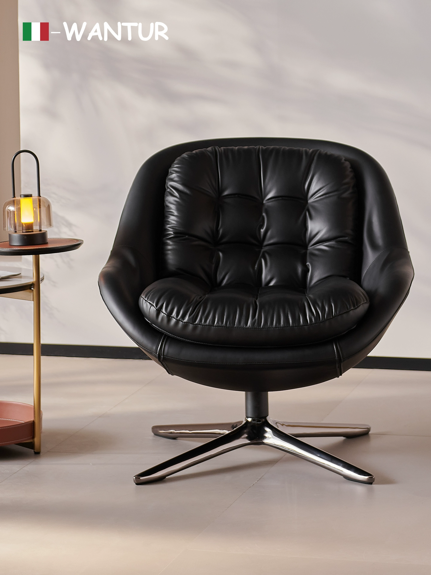 Minotti Kendall Armchair With a Black Leather Cover and a Four-spoke Aluminum Swivel Base