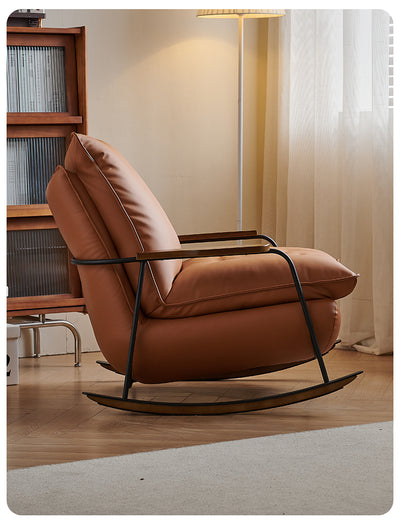 Elegant Casual Lazy Home Rocking Chair In a Tan Faux Leather Finish With a Black Metal Frame