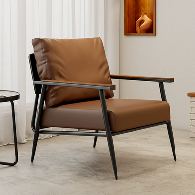 An Industrial-style Armchair With A Black Metal Frame, Wooden Armrests, and Tan Faux Leather Upholstery