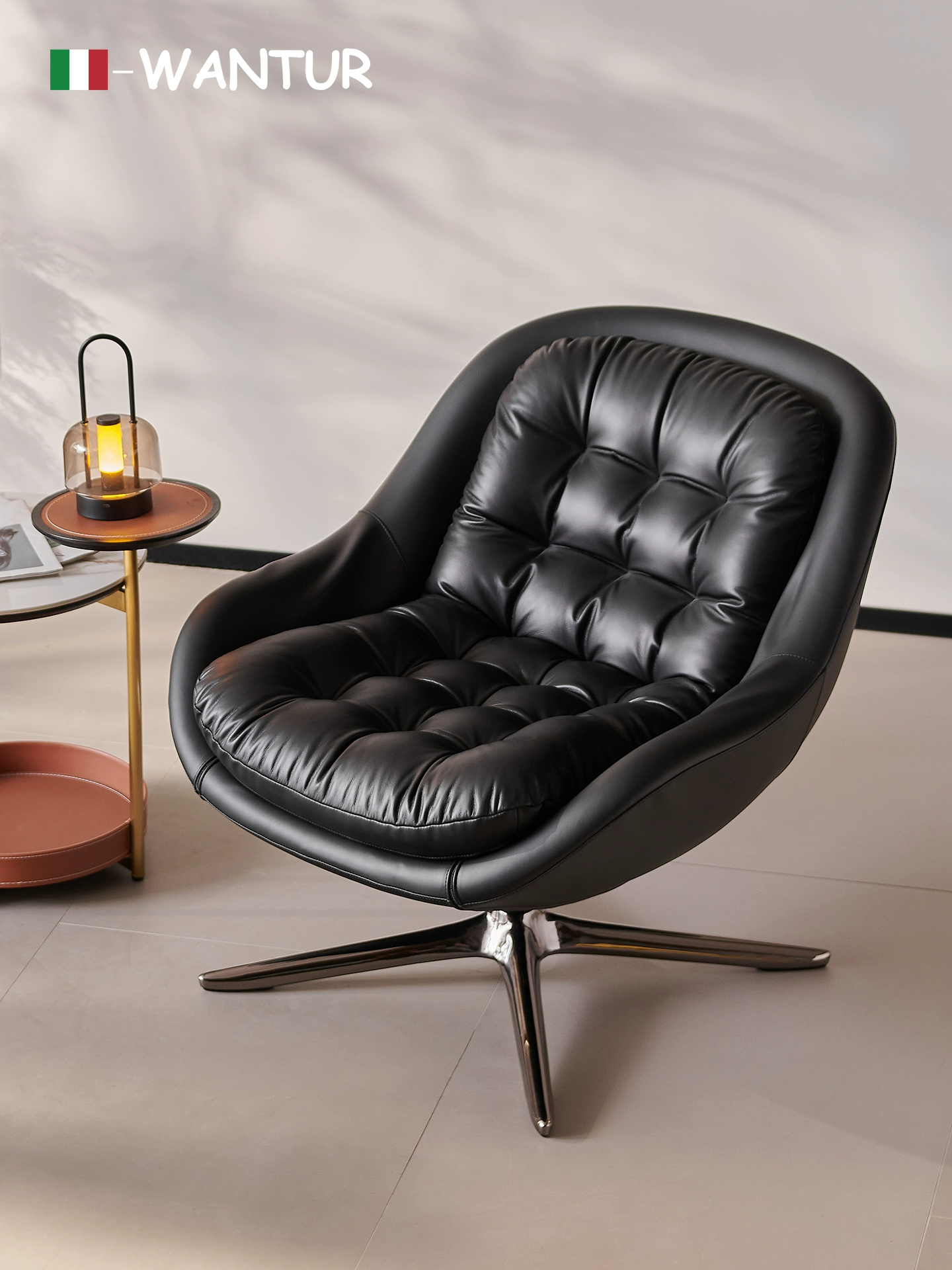 Minotti Kendall Armchair With a Black Leather Cover and a Four-spoke Aluminum Swivel Base