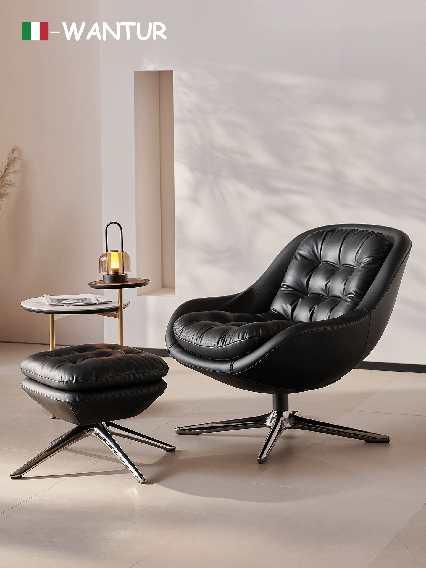 Minotti Kendall Armchair With a Black Leather Cover and a Four-spoke Aluminum Swivel Base