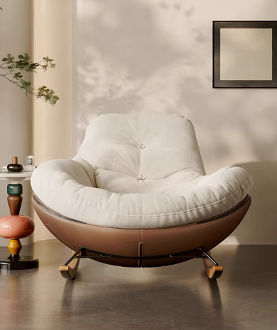 Modern Upholstered Rocking Chair With a Brown Leather Base and White Fabric Cushion